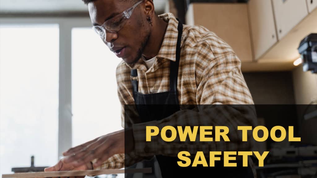 Power tool safety: man wearing safety glasses using a power tool